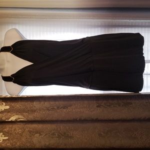 Black mini halter party dress with gold accent at shoulder